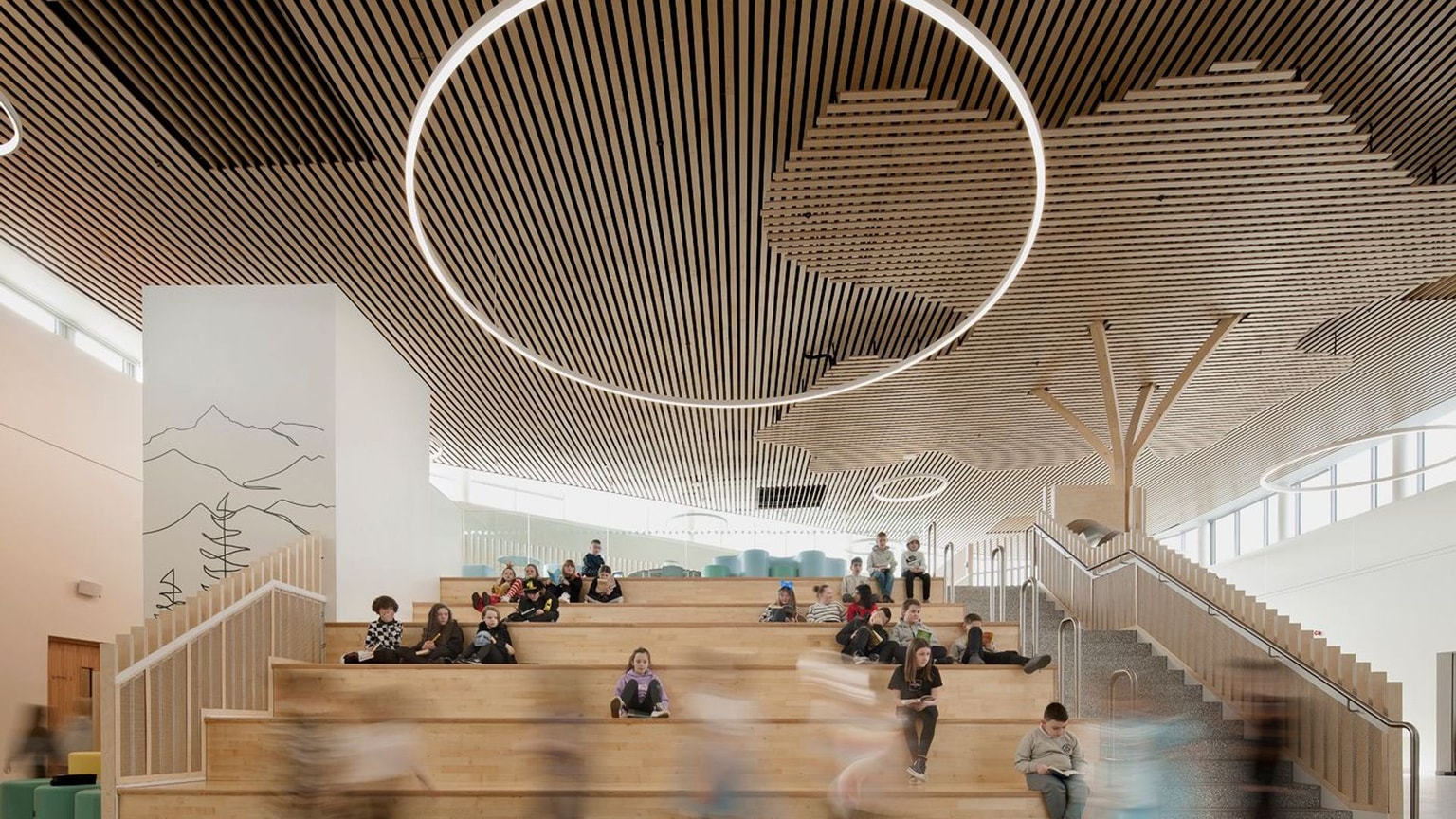 Newmains and St Bridig school interior atrium stairs with children