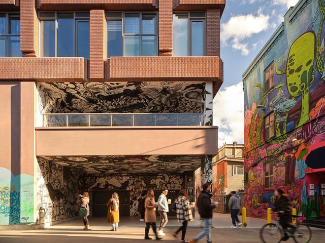 Rush condos Building from the ground floor straight on with graffiti